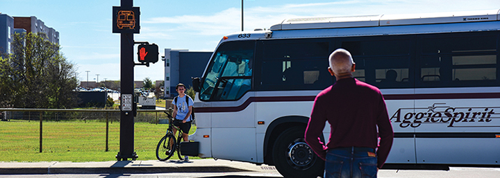 Bus, pedestrian, and bicyclist at a smart intersection.